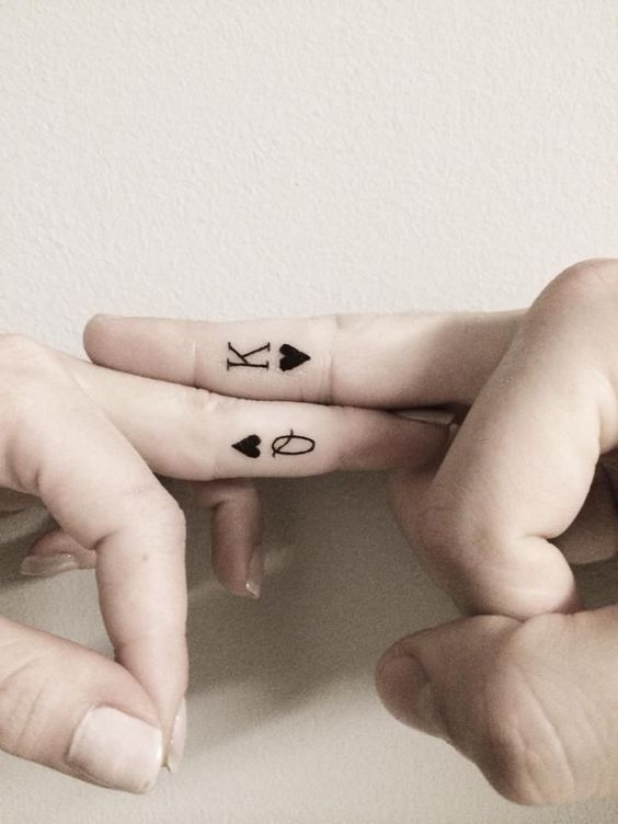 Finger couple tattoos